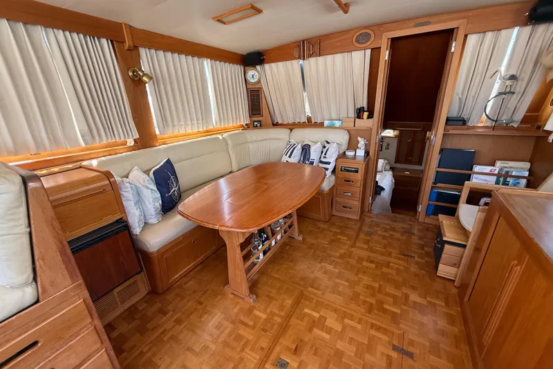 Slide: The Image of Interior of 1992 Grand Banks 46 Classic yacht with wood furnishings and seating area. - 11