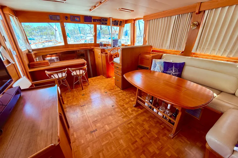 Slide: The Image of Luxurious 1992 Grand Banks 46 Classic yacht interior with wood finishes and spacious seating. - 20