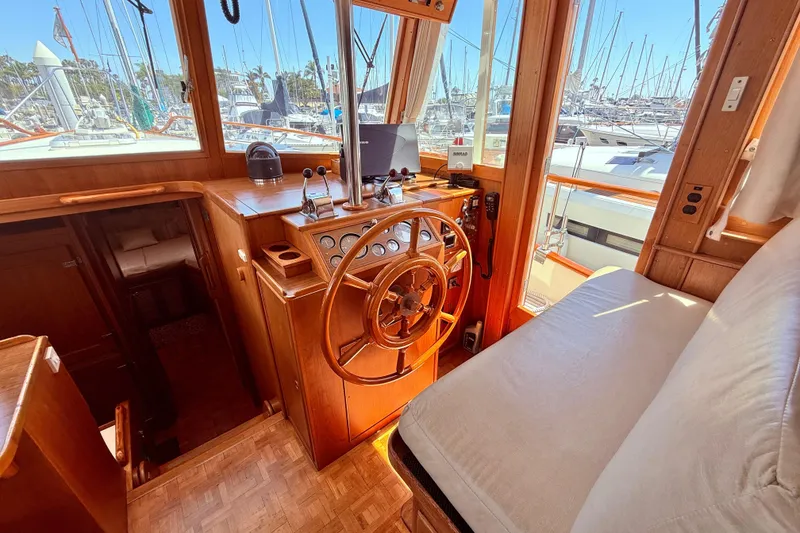 Slide: The Image of Interior helm of 1992 Grand Banks 46 Classic yacht with wooden steering wheel. - 21