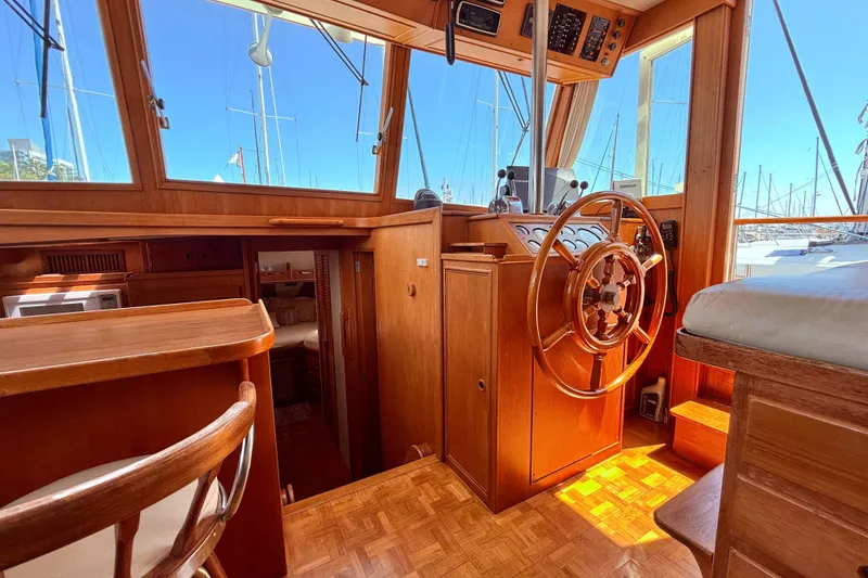 Slide: The Image of Interior of 1992 Grand Banks 46 Classic yacht with wooden helm and seating. - 22