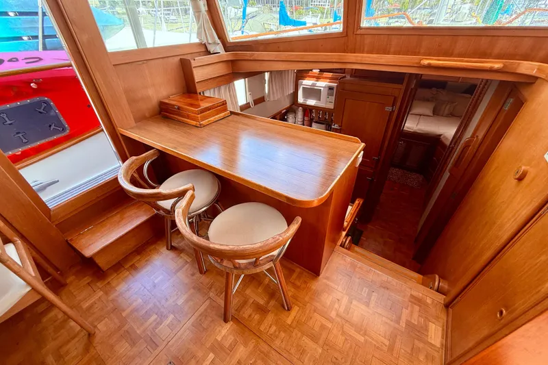 Slide: The Image of Interior of 1992 Grand Banks 46 Classic yacht with wooden bar and seating area. - 26