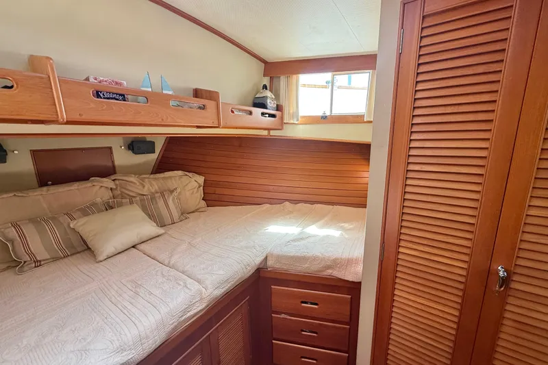 Slide: The Image of Cozy cabin interior of 1992 Grand Banks 46 Classic yacht with wooden furnishings. - 34