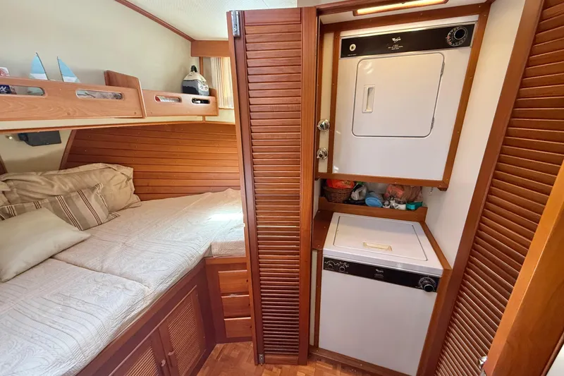 Slide: The Image of Cozy cabin with bed and laundry area in 1992 Grand Banks 46 Classic yacht. - 35