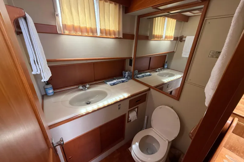 Slide: The Image of Bathroom interior of 1992 Grand Banks 46 Classic yacht, featuring sink and toilet. - 36