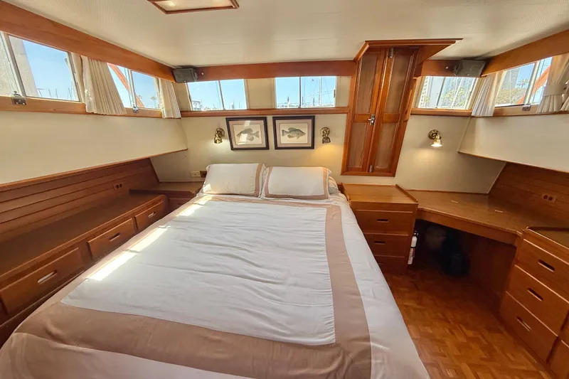Slide: The Image of Luxurious 1992 Grand Banks 46 Classic yacht bedroom with elegant wood furnishings. - 37