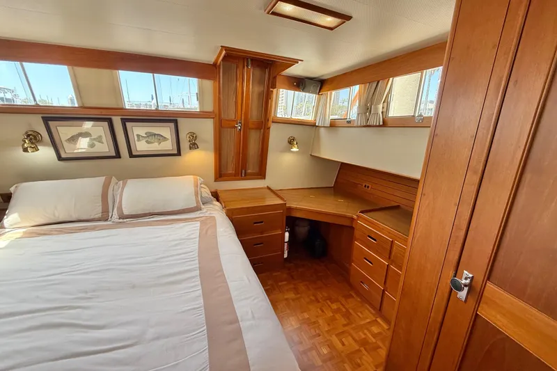 Slide: The Image of Luxurious 1992 Grand Banks 46 Classic yacht cabin with wood furnishings and natural light. - 40