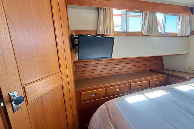 Slide: The Image of Interior of 1992 Grand Banks 46 Classic yacht with wood paneling and mounted TV. - 41