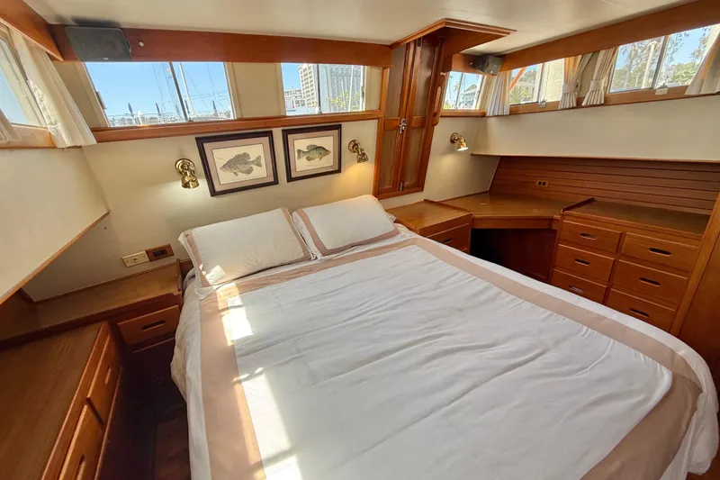 Slide: The Image of Cozy bedroom interior of 1992 Grand Banks 46 Classic yacht with wood furnishings. - 43