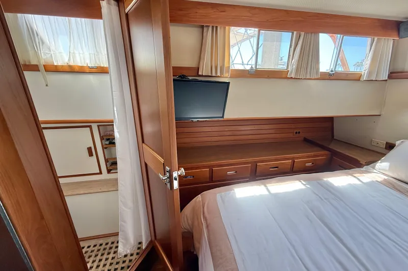 Slide: The Image of Cozy cabin interior of 1992 Grand Banks 46 Classic yacht with wood accents and natural light. - 47