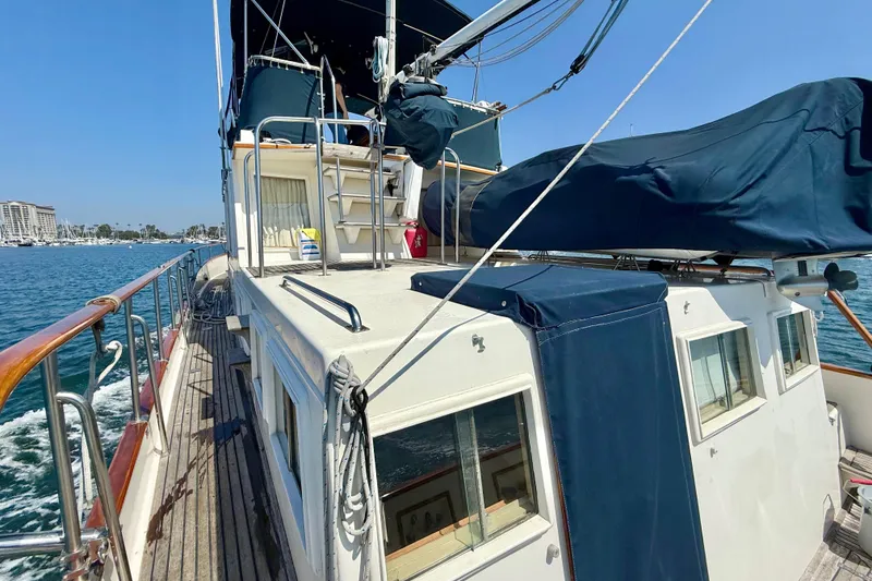 Slide: The Image of 1992 Grand Banks 46 Classic yacht on water, showcasing deck and cabin details. - 56