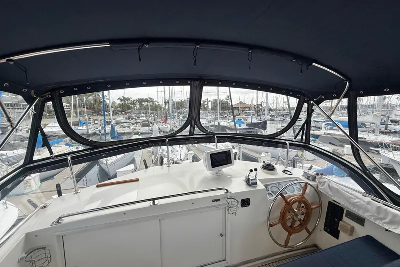 Slide: The Image of Interior view of 1992 Grand Banks 46 Classic yacht helm, overlooking marina. - 66