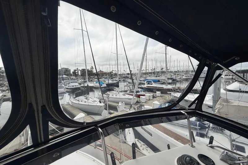 Slide: The Image of View from 1992 Grand Banks 46 Classic yacht, overlooking a busy marina with sailboats. - 67