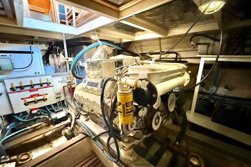 Slide: The Image of Engine room of a 1992 Grand Banks 46 Classic yacht, showcasing machinery and components. - 72