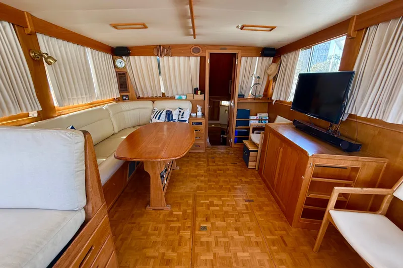 Slide: The Image of Interior of 1992 Grand Banks 46 Classic yacht with wood furnishings and seating area. - 9