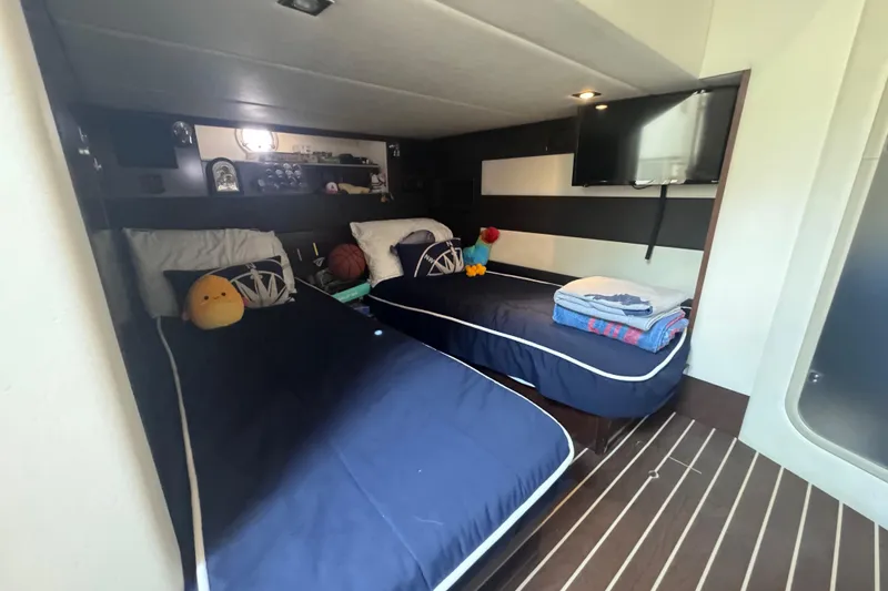 Slide: The Image of Cozy cabin interior of 2012 Cruisers Yachts 41 Cantius with twin beds and modern decor. - 47