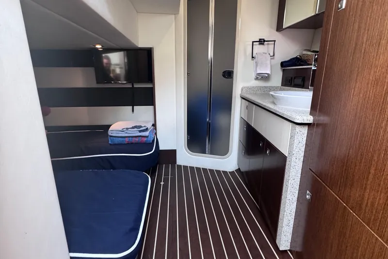 Slide: The Image of Interior of 2012 Cruisers Yachts 41 Cantius with bunk beds and modern amenities. - 49