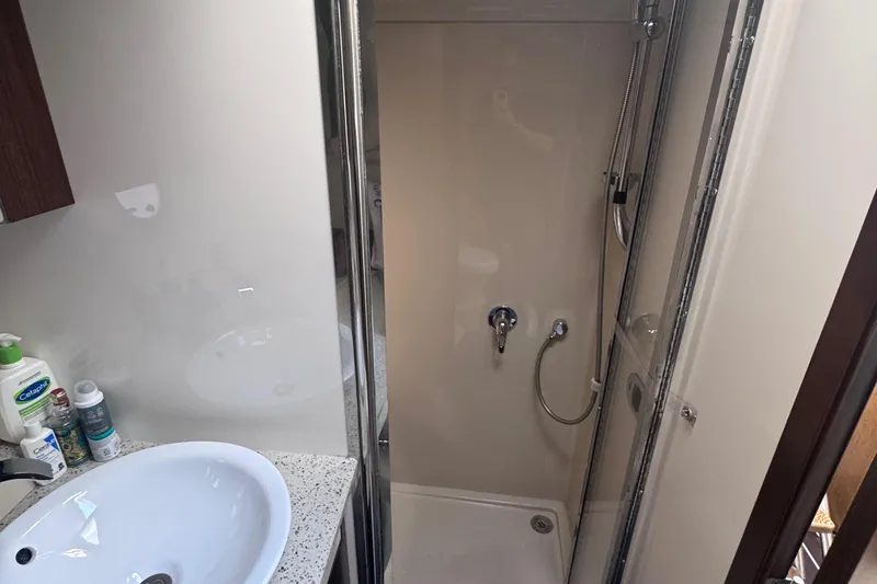 Slide: The Image of Bathroom interior of 2012 Cruisers Yachts 41 Cantius, featuring a shower and sink. - 52