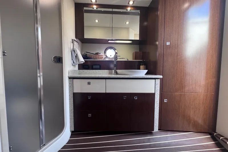 Slide: The Image of Luxurious bathroom interior of 2012 Cruisers Yachts 41 Cantius with modern fixtures and wood accents. - 54