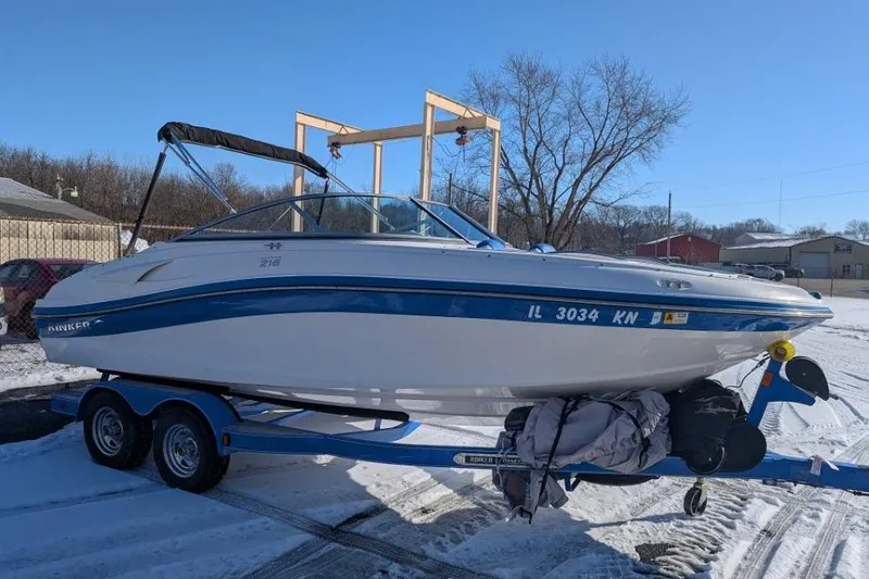 The Image of 2012 Rinker 216 Captiva Bowrider on trailer in snowy outdoor setting. - 0