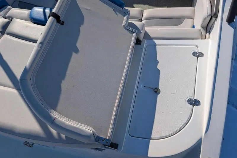 Slide: The Image of 2012 Rinker 216 Captiva Bowrider interior seating and storage compartment. - 4