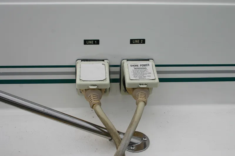 Slide: The Image of Shore power connections on a 1991 Sea Ray 310/330 Sundancer boat. - 23