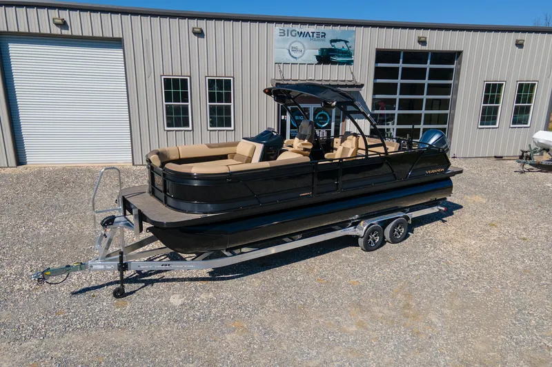 The Image of 2026 Veranda VR 265 VLI pontoon boat on trailer outside marine dealership. - 0