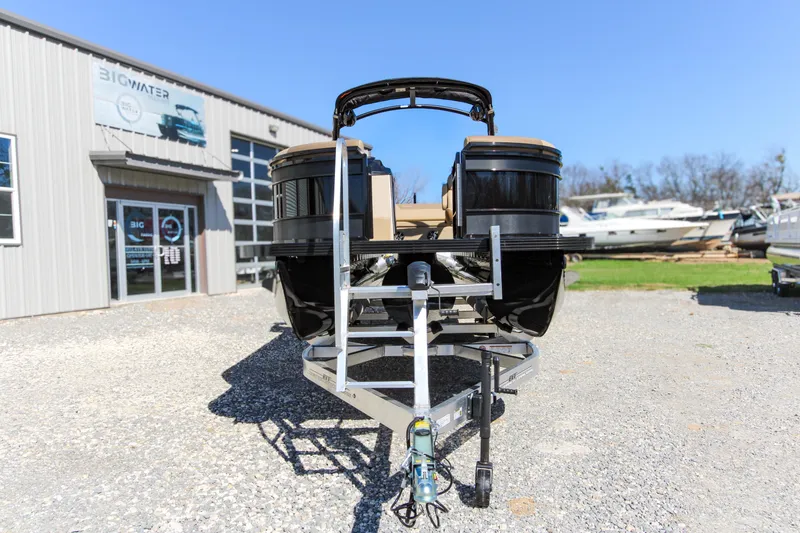 Slide: The Image of 2026 Veranda VR 265 VLI pontoon boat on trailer outside dealership. - 10