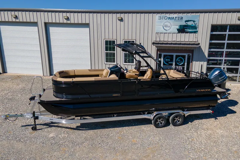 Slide: The Image of 2026 Veranda VR 265 VLI pontoon boat on trailer outside Big Water Marine. - 4