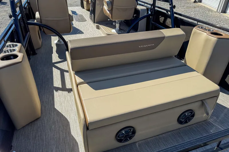 Slide: The Image of 2026 Veranda VR 265 VLI boat interior with beige seating and cup holders. - 7