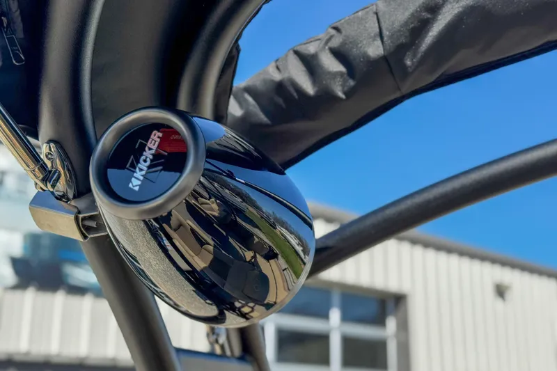 Slide: The Image of Kicker speaker on Veranda VR 265 VLI boat, 2026 model, under clear blue sky. - 8