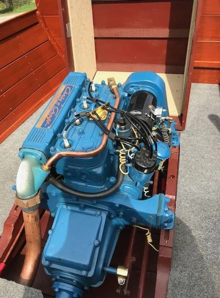 Slide: The Image of 1967 Chris-Craft 17 Deluxe engine in wooden boat. - 11
