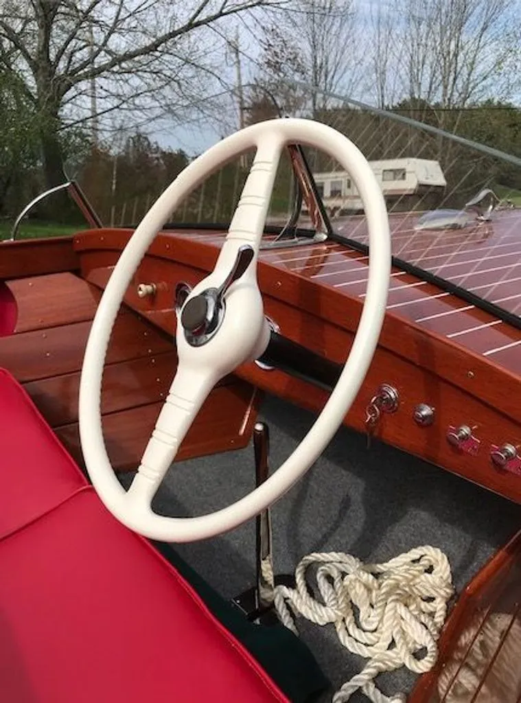 Slide: The Image of Interior of a 1967 Chris-Craft 17 Deluxe boat with red seating. - 2