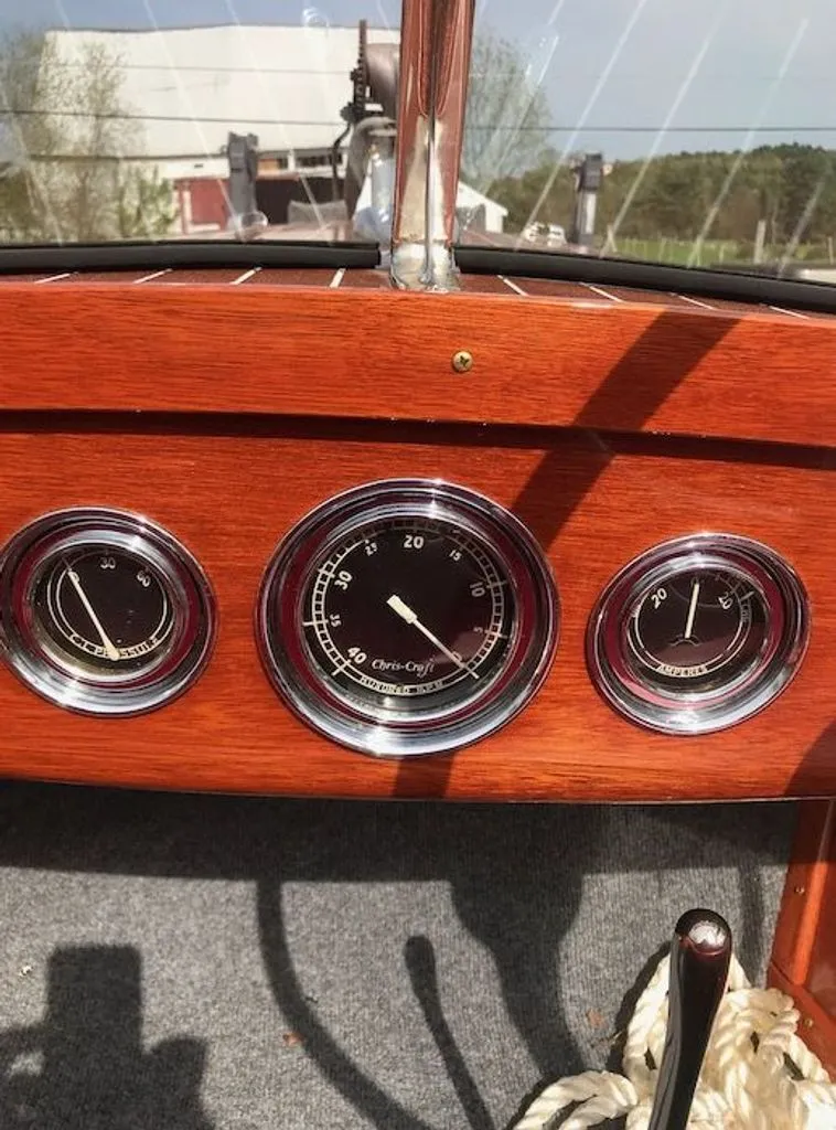 Slide: The Image of Dashboard of a 1967 Chris-Craft 17 Deluxe boat with wood finish. - 3