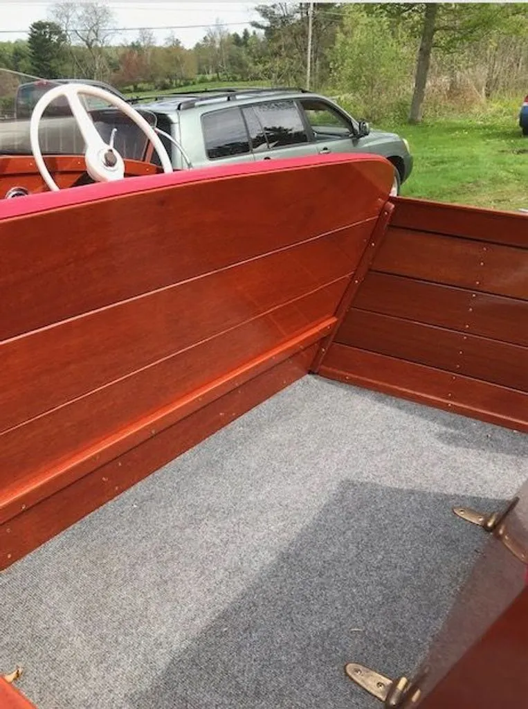 Slide: The Image of Interior of a 1967 Chris-Craft 17 Deluxe boat with wooden paneling. - 5