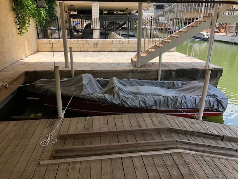 Slide: The Image of 1967 Chris-Craft 17 Deluxe boat covered at dock. - 9