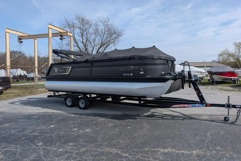 The Image of 2022 Viaggio 23 S pontoon boat on trailer, covered and parked outdoors. - 1