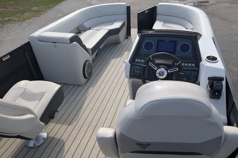 Slide: The Image of 2022 Viaggio 23 S pontoon boat interior with modern helm and spacious seating. - 10