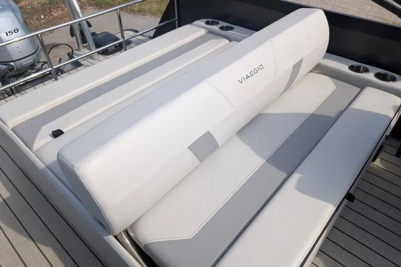 Slide: The Image of Luxurious seating on 2022 Viaggio 23 S boat, featuring sleek design and cup holders. - 11