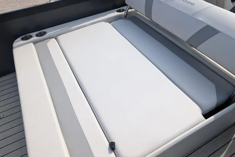 Slide: The Image of 2022 Viaggio 23 S boat interior with cushioned seating and cup holders. - 12