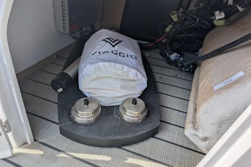 Slide: The Image of Storage compartment of a 2022 Viaggio 23 S boat with equipment and wiring. - 15