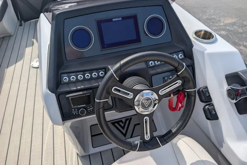 Slide: The Image of 2022 Viaggio 23 S boat dashboard with steering wheel and control panel. - 3