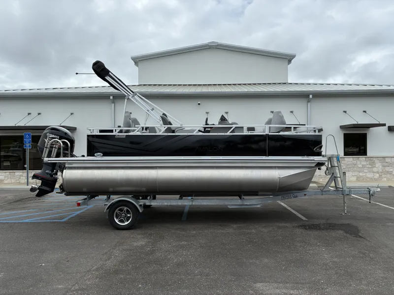 The Image of 2026 Avalon Venture Quad Fish 19' pontoon boat on trailer. - 1