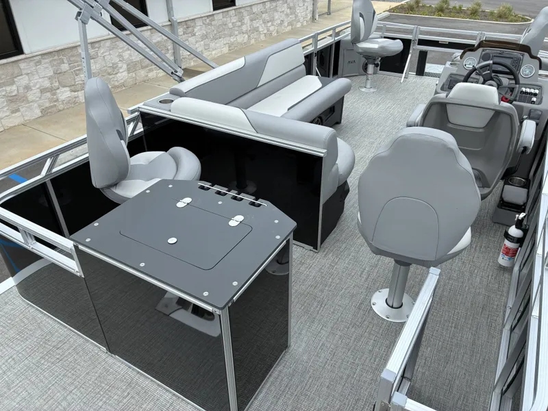 Slide: The Image of Interior of 2026 Avalon Venture Quad Fish with gray seating. - 15