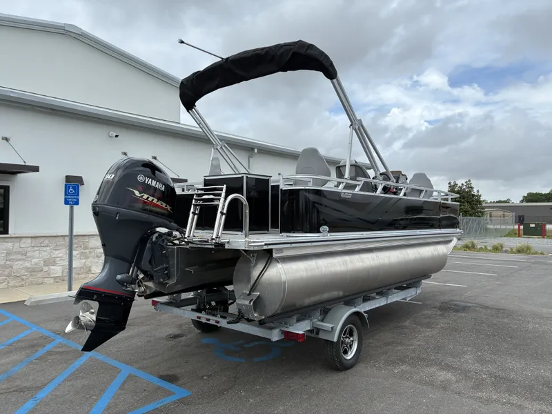 Slide: The Image of 2026 Avalon Venture Quad Fish boat on trailer, Yamaha engine. - 6