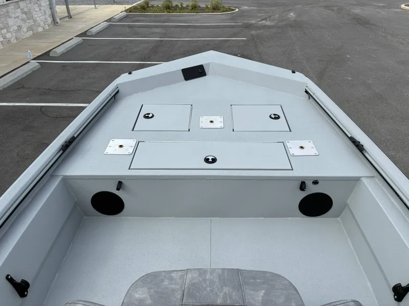 Slide: The Image of Avid 18CC ROGUE 2026 boat deck with storage compartments and speakers. - 14