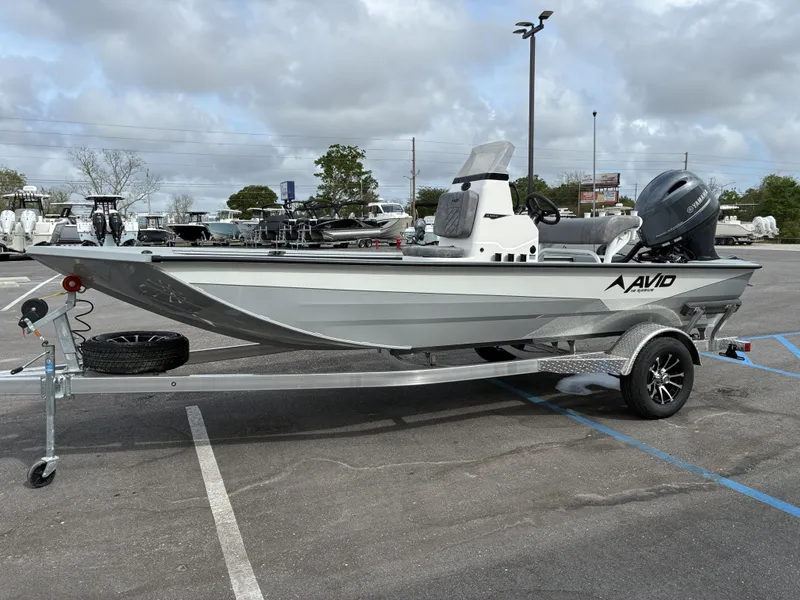 Slide: The Image of Avid 18CC ROGUE 2026 boat on trailer outdoors. - 6