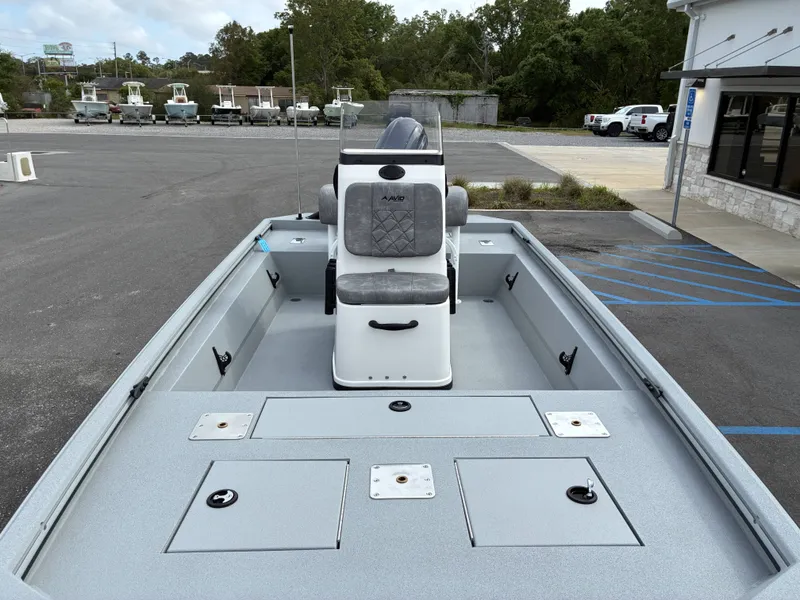 Slide: The Image of Avid 18CC ROGUE 2026 boat on parking lot, gray upholstery. - 7