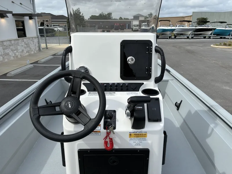 Slide: The Image of Steering console of Avid 18CC ROGUE boat, model year 2026. - 9