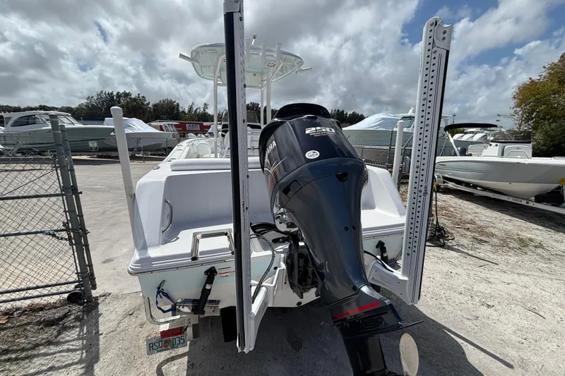 Slide: The Image of 2022 Sportsman Heritage 231 Center Console boat with Yamaha 250 engine, parked outdoors. - 10