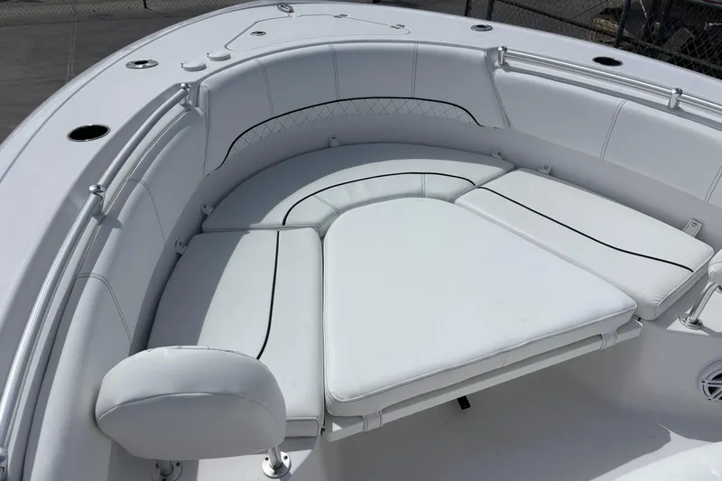 Slide: The Image of 2022 Sportsman Heritage 231 Center Console boat with luxurious white seating. - 11